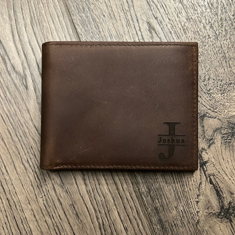 Brand new unused full grain leather wallet. Engraved name Joshua and a psalms.